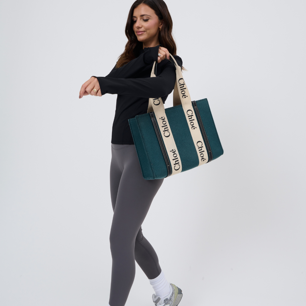 Activewear black mid zip jacket with bag view