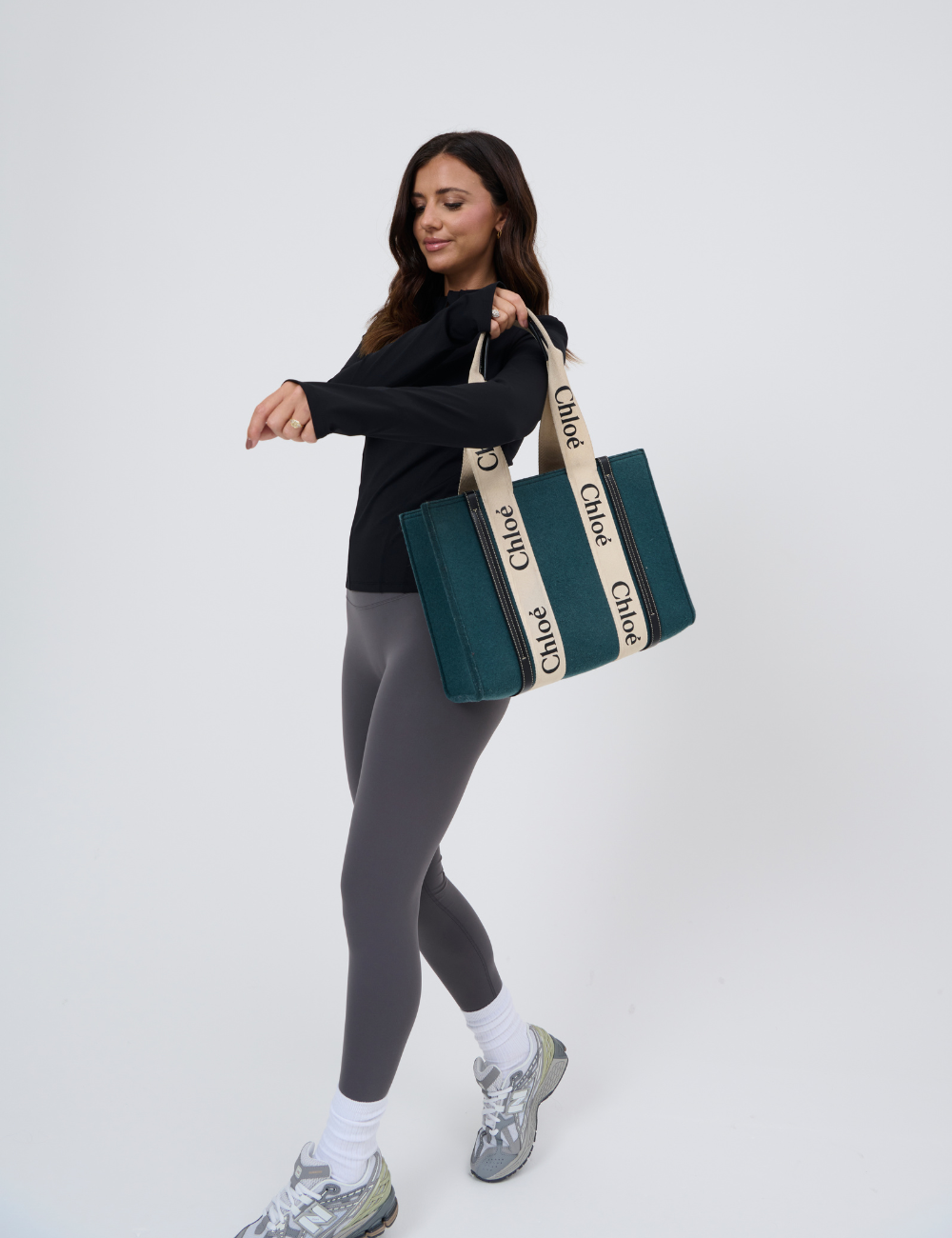 Activewear black mid zip jacket with bag view